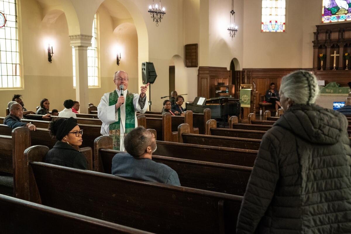 Pastor Todd Benson addresses a visitor during worship at Bethlehem Lutheran Church in Oakland.
