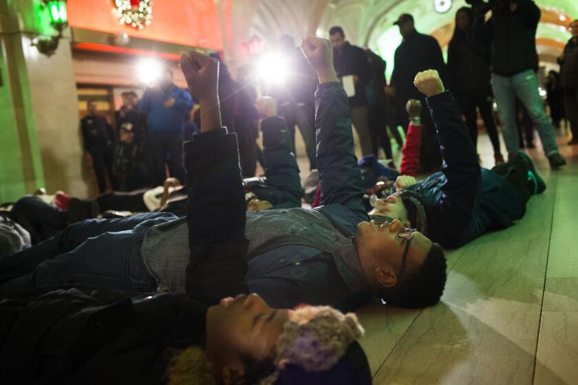 Protesters of the fatal police shooting of Laquan McDonald stage a "die-in" Dec. 22 2015, at City Hall in Chicago.