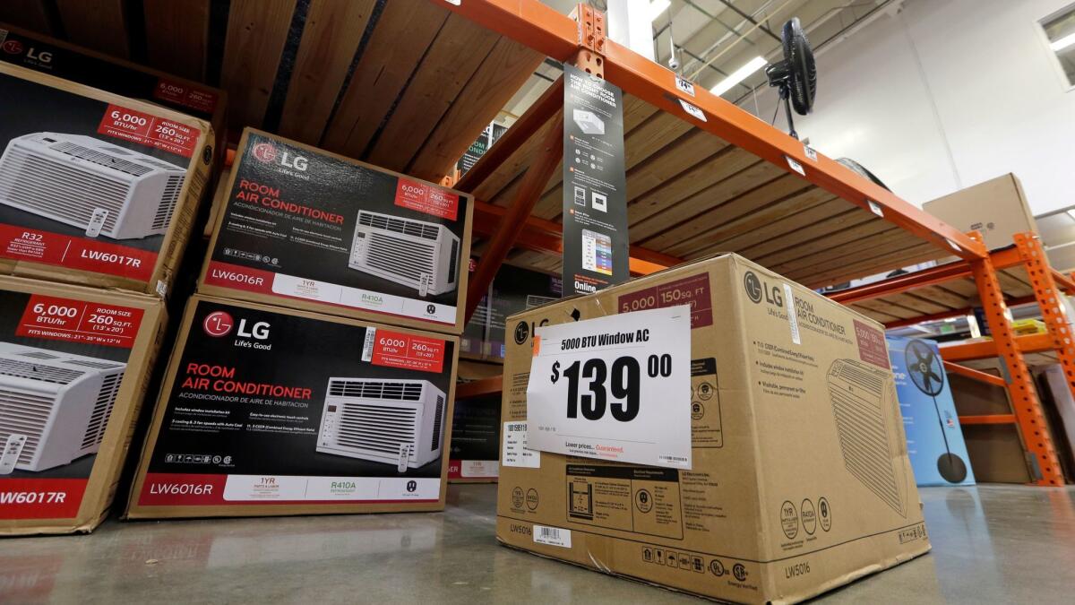 Air conditioners and fans are displayed at a hardware store in Seattle.