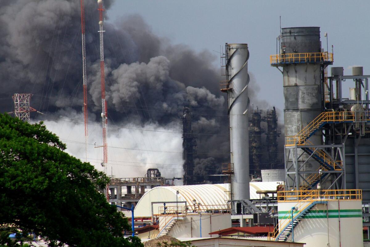 Smoke billows from the Pemex petrochemical plant in Coatzacoalcos, Veracruz state, Mexico. The explosion killed three and injured dozens.