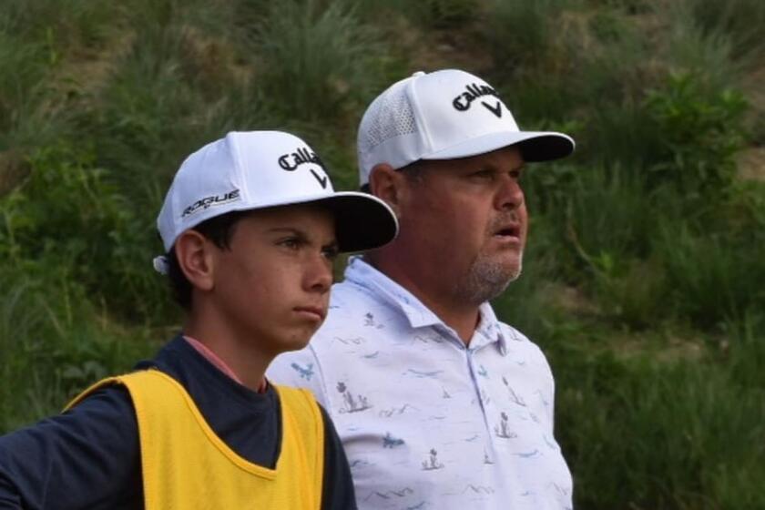 Ty Smock, left, and his father Brian look out during the 2022 PGA Professional Championship in Austin.