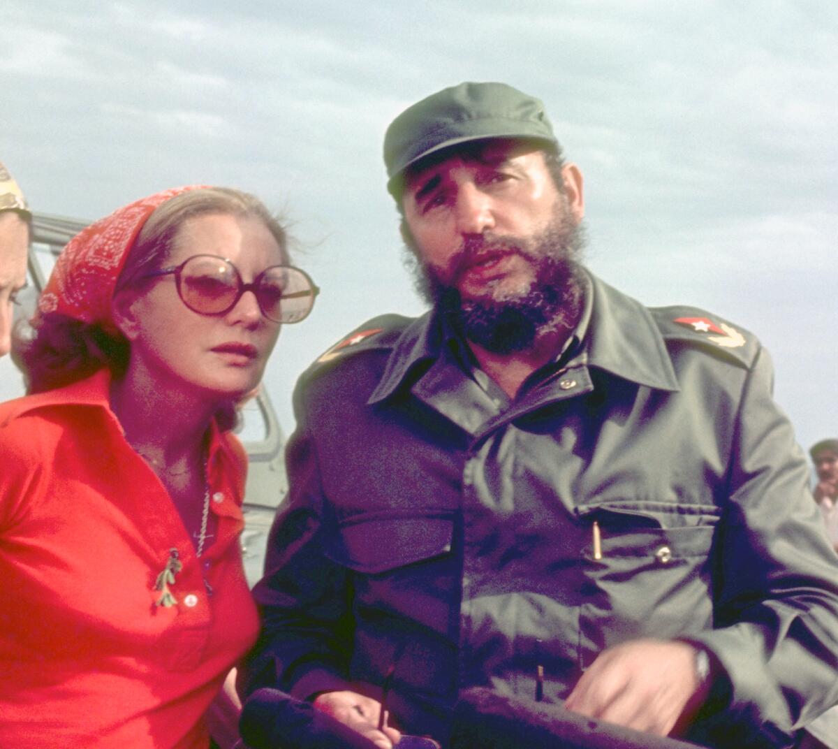 Barbara Walters standing next to Cuban President Fidel Castro in 1977.