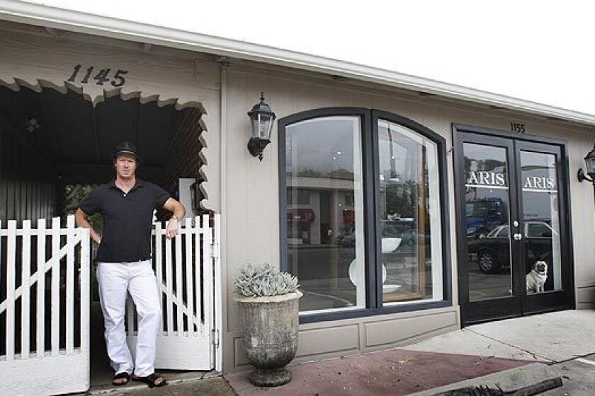 In writing a profile of Laguna Beach retailer Trey Russell, Times Staff Writer Barbara Thornburg found that Russell truly lives what he loves. His second-story garden apartment is right behind his gift shop-boutique Aris, set in a former 1950s Volkswagen dealership in north Laguna Beach on a quiet strip of Pacific Coast Highway.