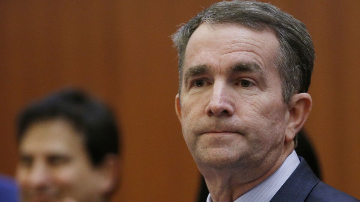 Virginia Gov. Ralph Northam has no immediate plans to resign after a racist picture in his 1984 medical yearbook went public Friday, a source told the Associated Press.