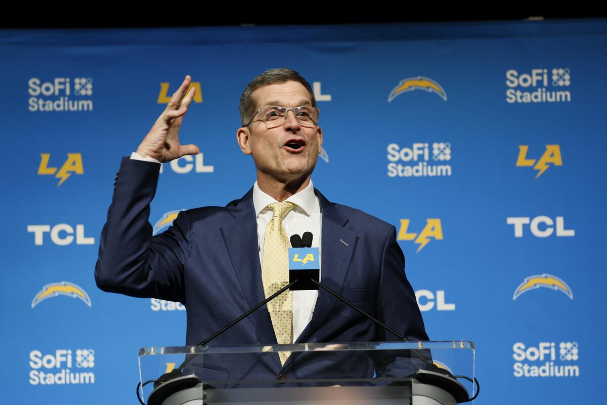 Chargers coach Jim Harbaugh speaks during his introductory press conference.