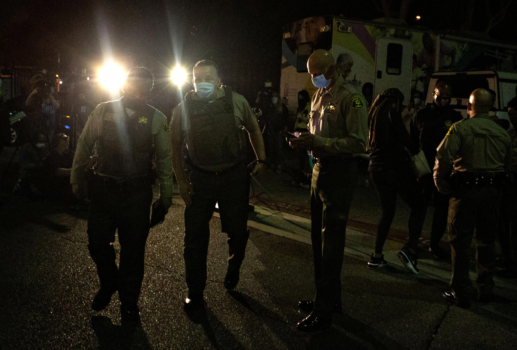 L.A. County Sheriff Alex Villanueva exits a news conference in Lynwood.