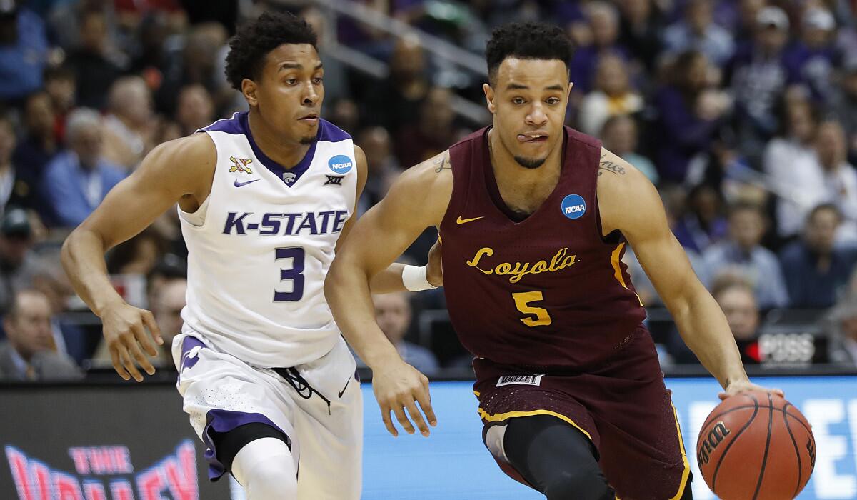 Loyola Chicago's Marques Townes dribbles past Kansas State's Kamau Stokes.