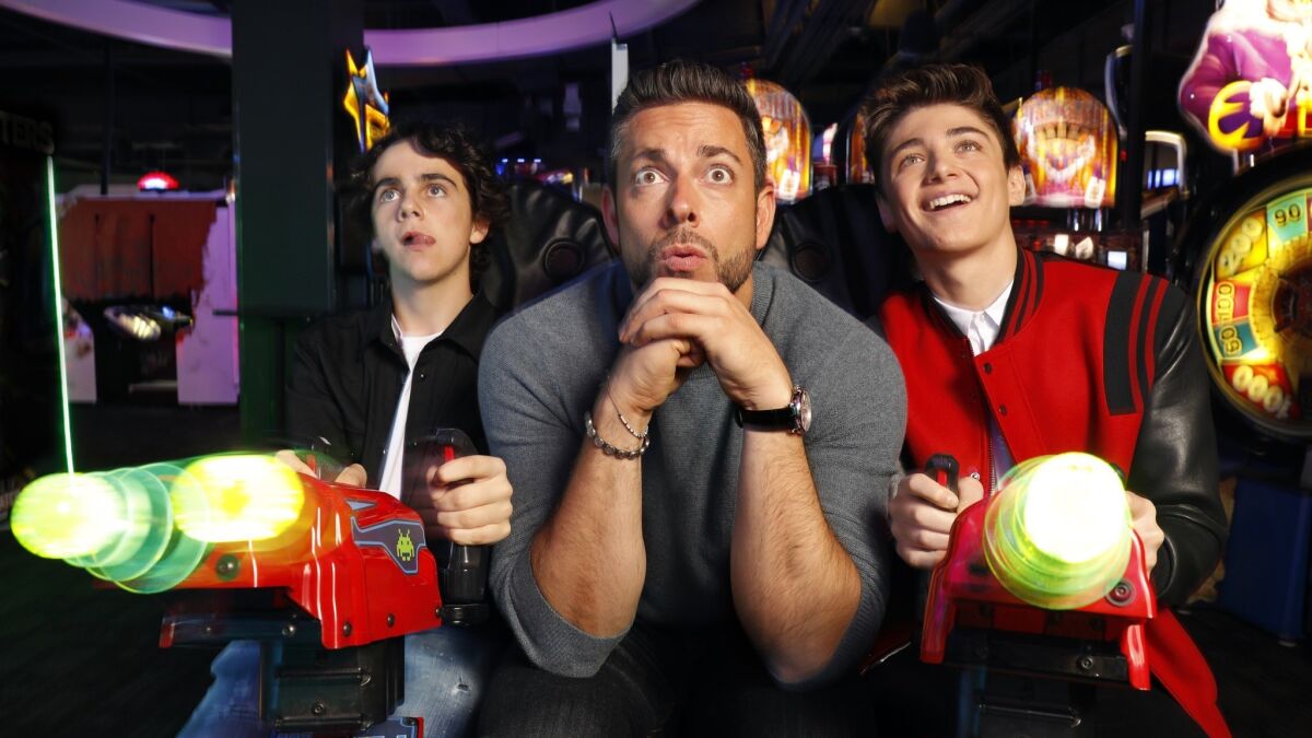 From left, "Shazam!" stars Jack Dylan Grazer, Zachary Levi and Asher Angel photographed at Dave & Buster's in Hollywood on March 22, 2019.