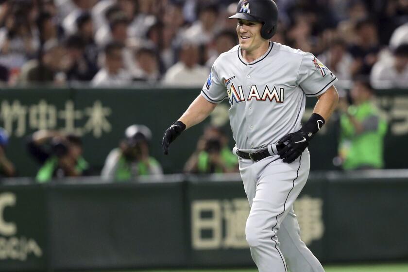 MLB All-Star designated hitter J.T. Realmuto of the Miami Marlins rounds third base after hitting a solo home run off All Japan starter Shinsaburo Tawata in the fourth inning of Game 3 of their All-Stars Series baseball at Tokyo Dome in Tokyo, Sunday, Nov. 11, 2018. (AP Photo/Toru Takahashi)